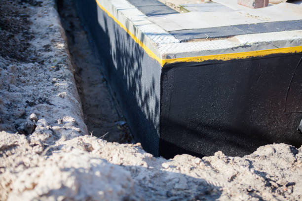 Professional Emergency Waterproofing technician working in Hartland, WI
